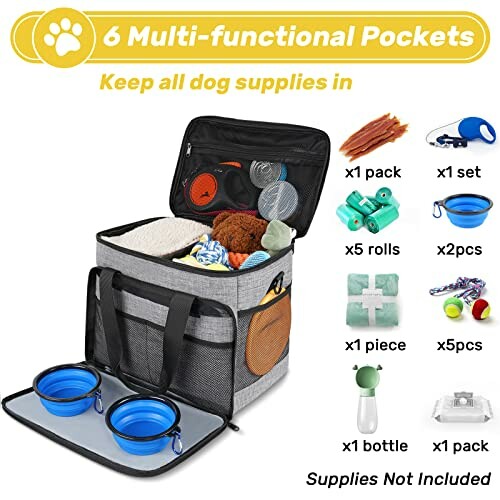 Dog travel bag with compartments and various pet supplies displayed.